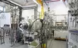High-tech industrial testing facility with mechanical seal systems, pressure gauges, and precision engineering equipment.